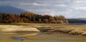 Dry lake during cloudy autumn day