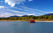 Houseboat and mountains in summer