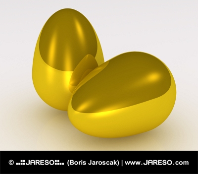 Две златни яйца на бял фон